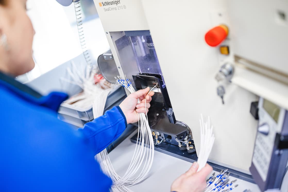 Cables being processed at the crimping machine
