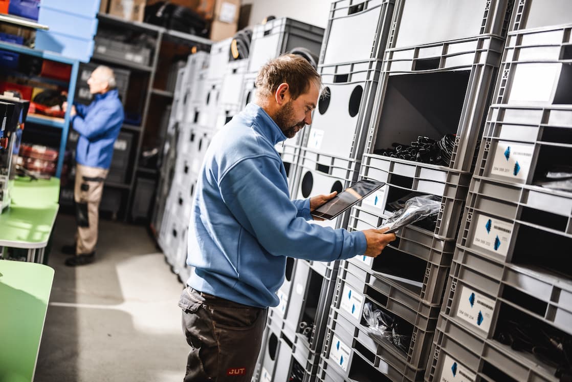 Employee taking material from a storage rack